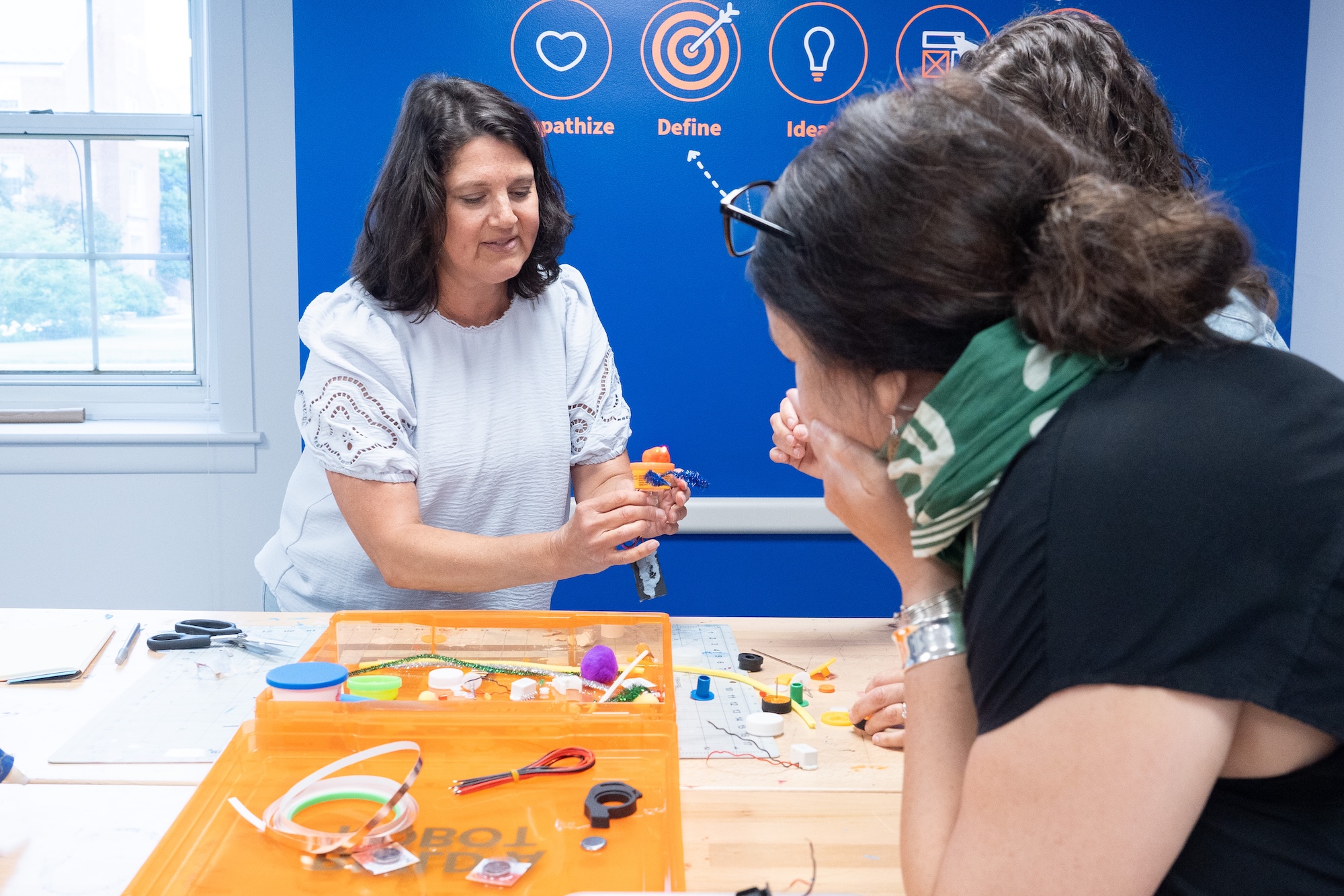 students innovating together at table